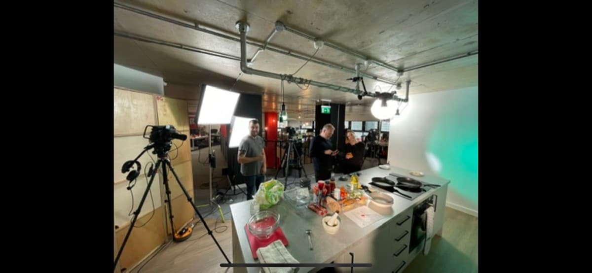 A camera setup for filming in a working corporate location