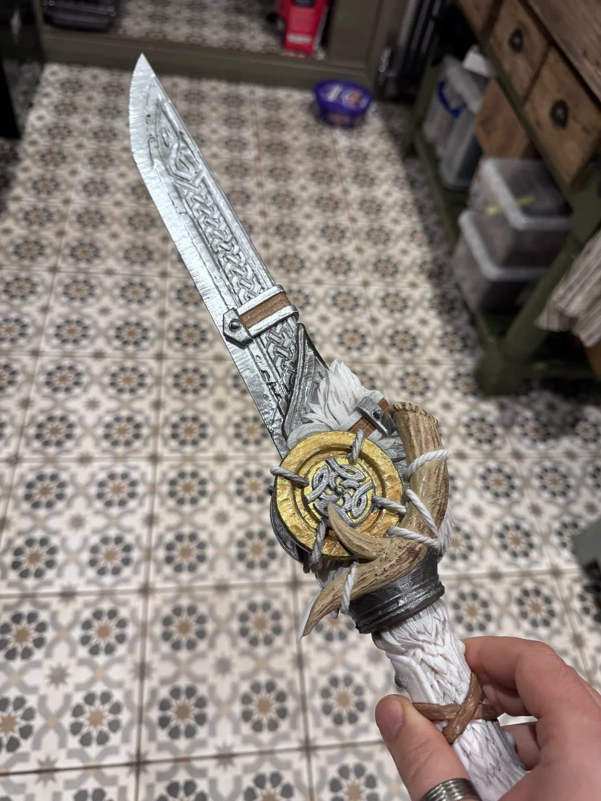 Finished fantasy dagger with an ornate silver blade and gold guard