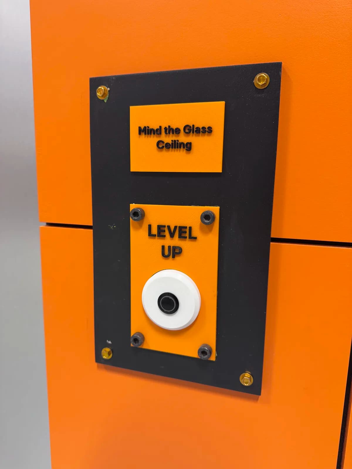 Finished orange lift control panel mounted on the set wall