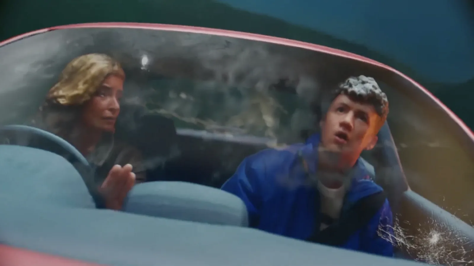 Finished frame showing the two miniature figures inside the car
