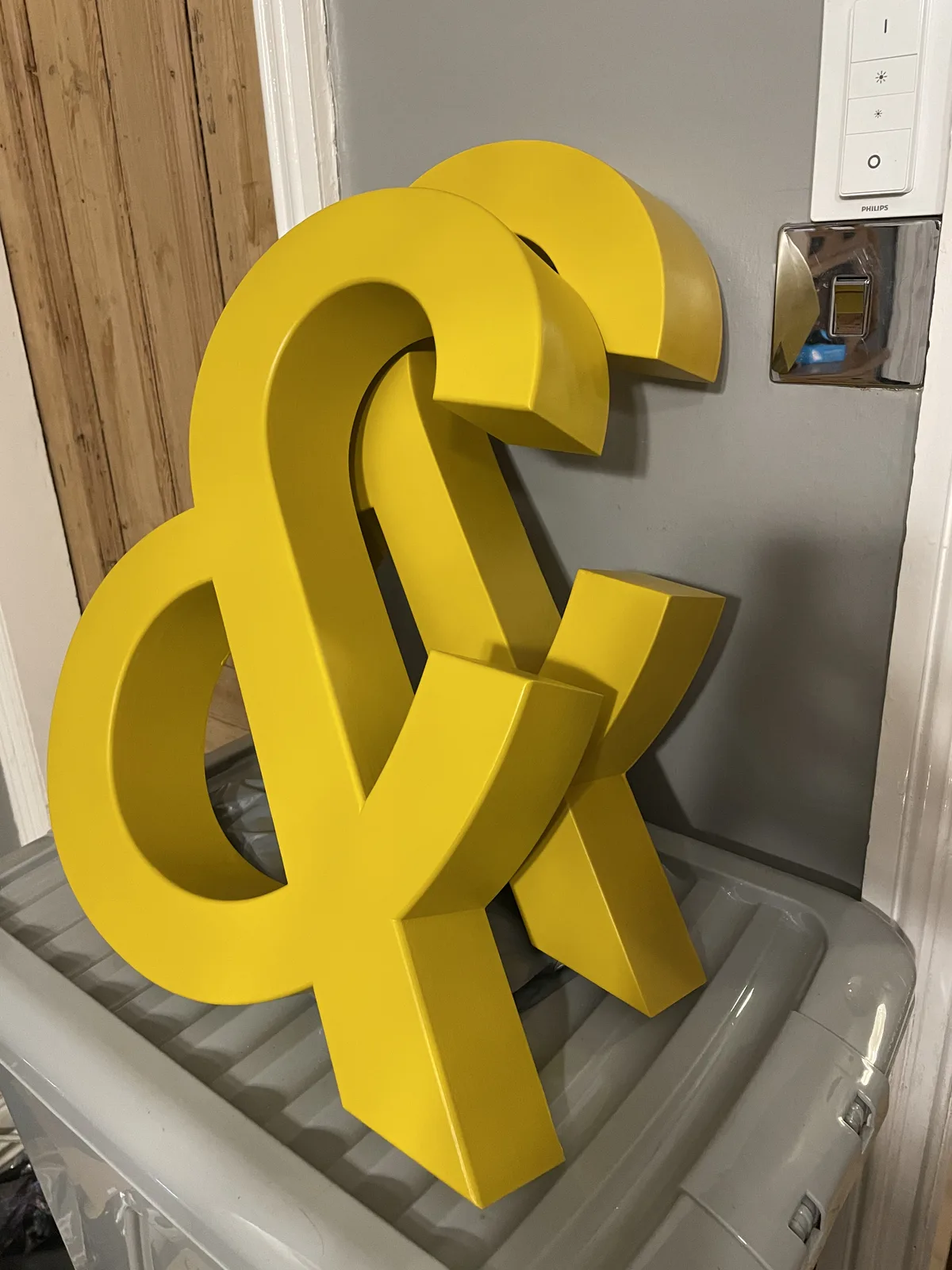 Two completed yellow ampersand props standing together