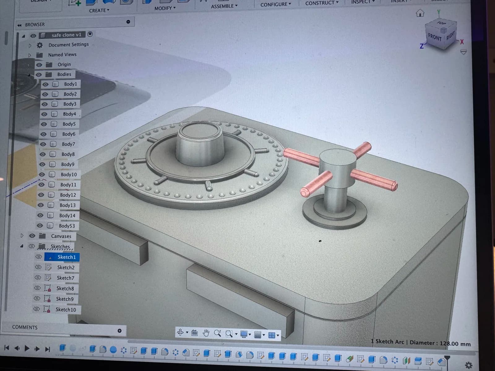 CAD model of a vault safe dial and handle displayed on a screen
