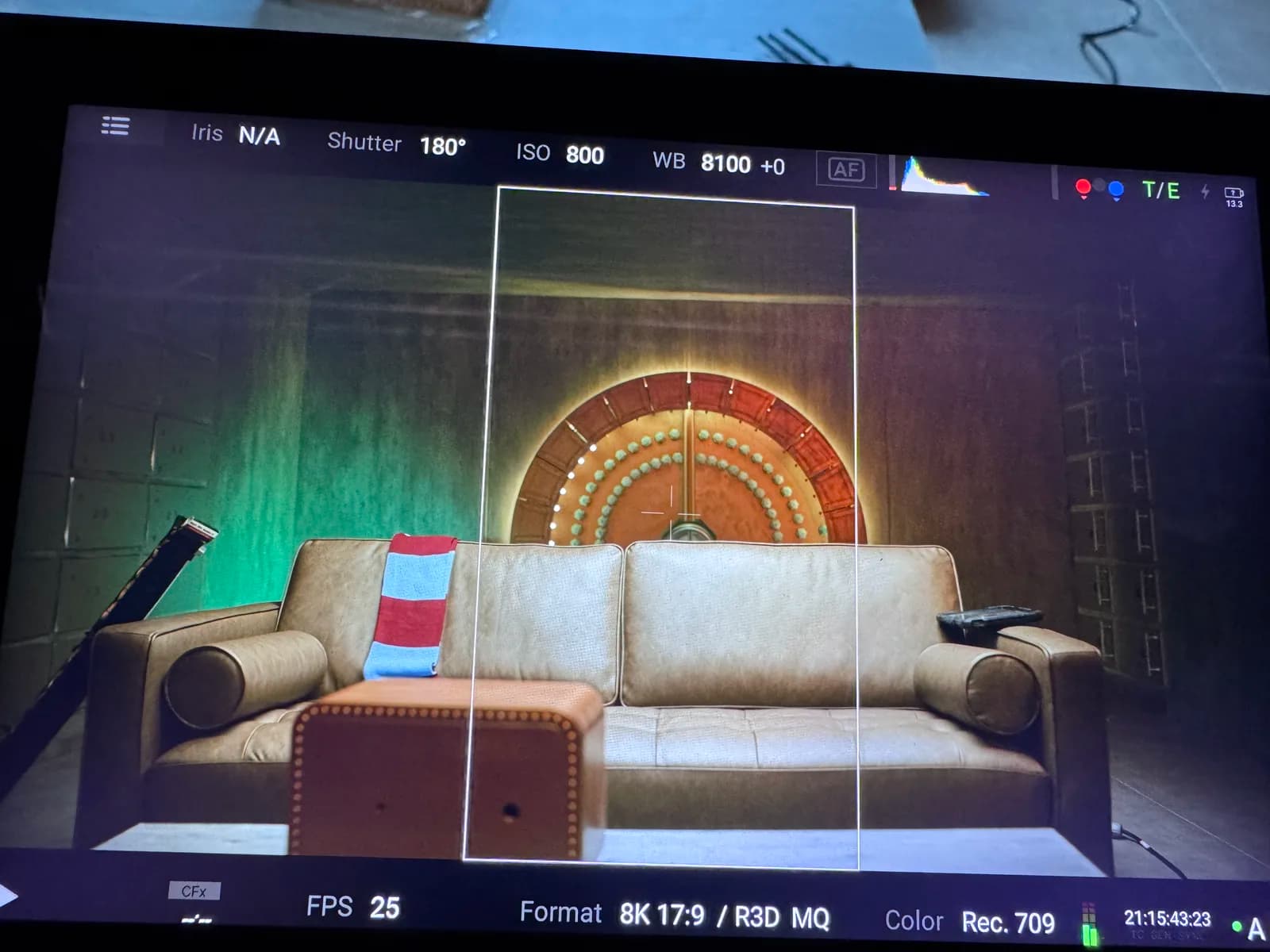 Camera monitor showing the sofa set with the vault door behind it